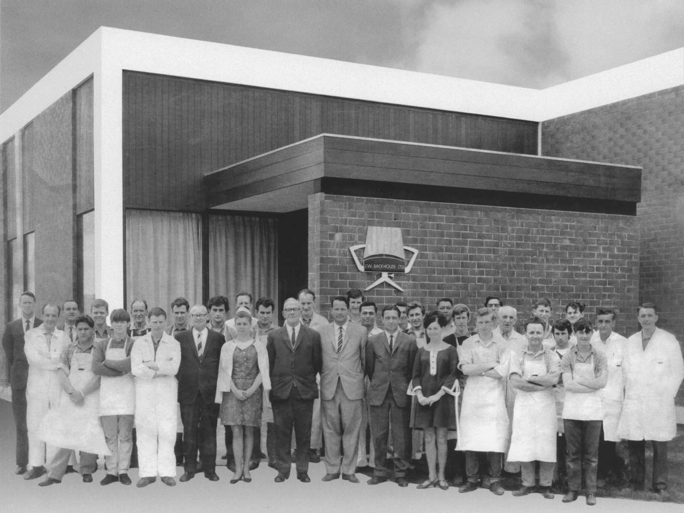 Factory and office staff outside JW Backhouse Ltd in Porirua, circa 1966