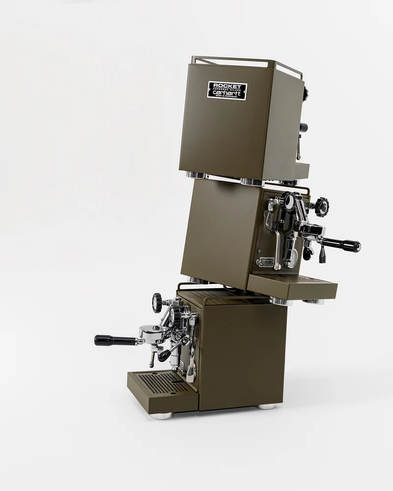 Three army-green Carhartt WIP × Rocket Espresso machines stacked in the 2019 campaign photograph