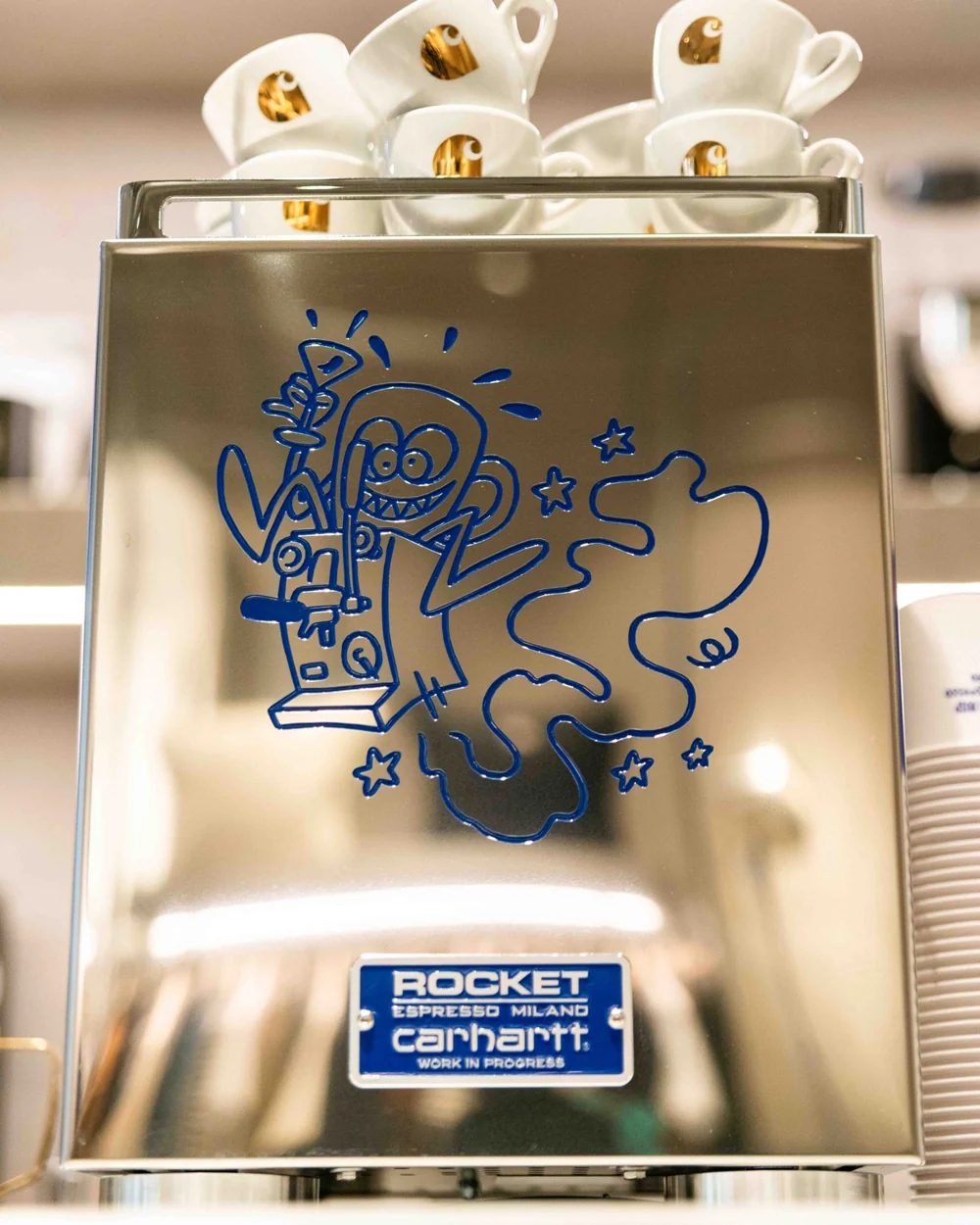 Blue illustrated artwork on the back of the Carhartt WIP × Rocket Espresso machine