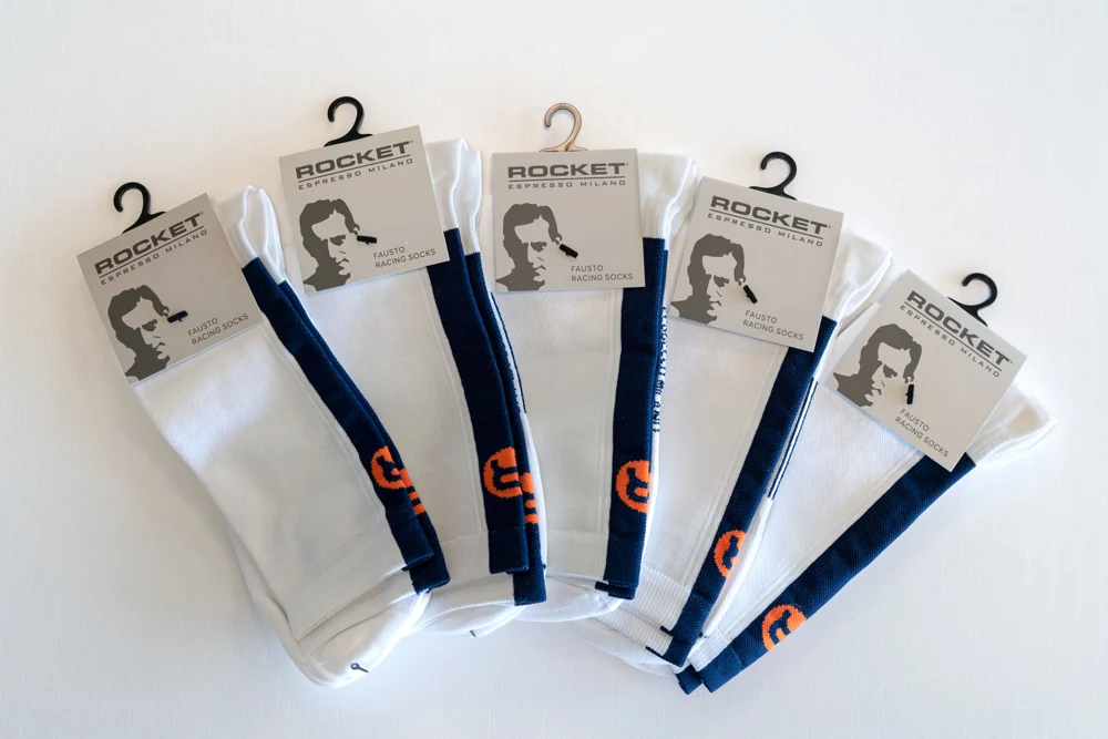 Packaged Rocket cycling socks arranged in a fan