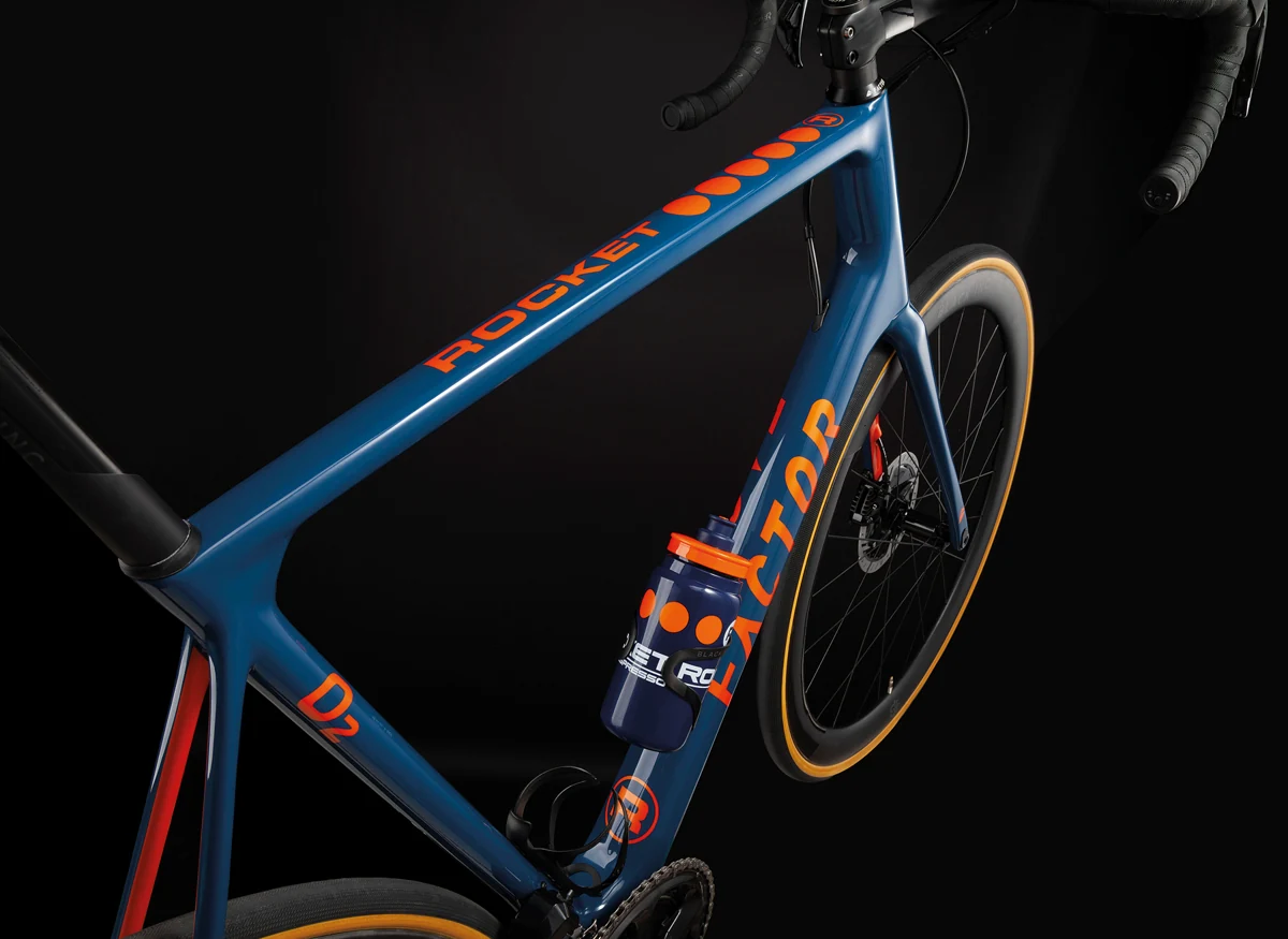 Detail of the blue and orange custom Rocket × Factor bicycle frame