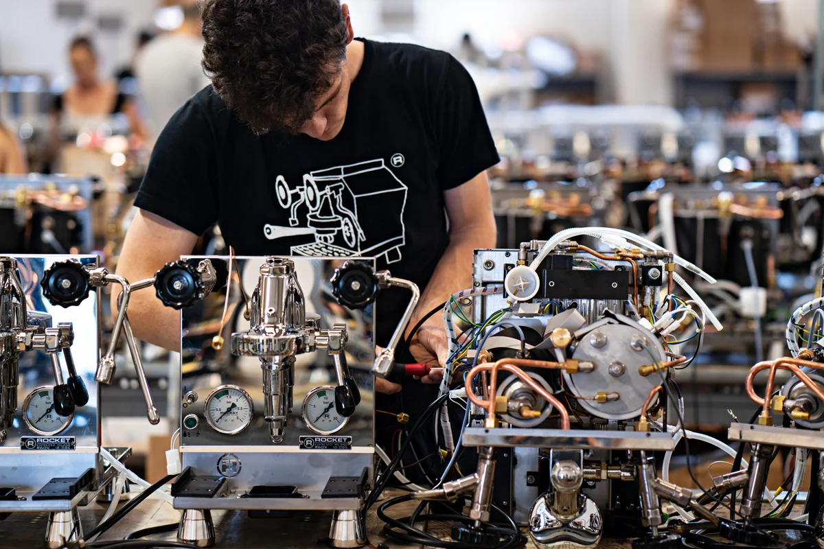 A Rocket team member assembling an espresso machine