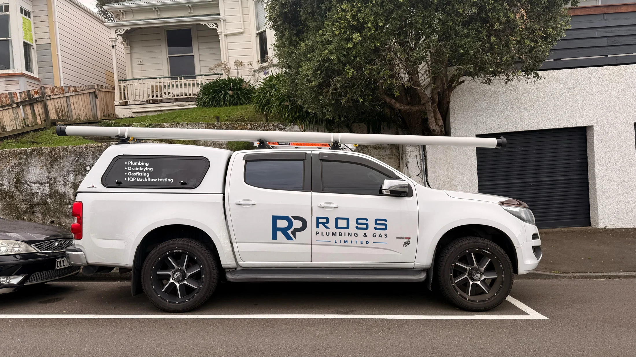 Ross Plumbing identity shown on a vehicle mockup